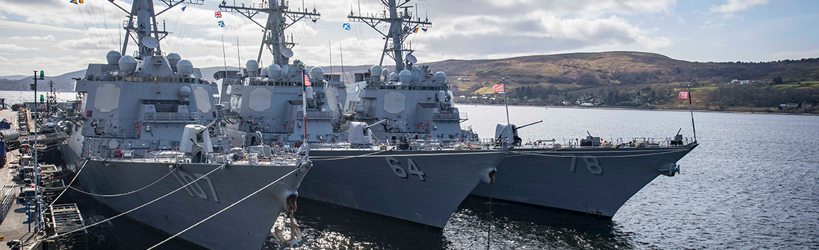 The Arleigh Burke-class guided-missile destroyers USS Gravely (DDG 107), USS Carney (DDG 64), and USS Porter (DDG 78) are moored at HMNB Clyde in Faslane, Scotland