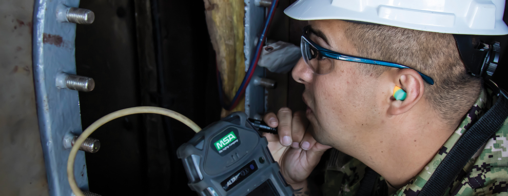 Damage Controlman Tests a Confined Space Aboard USS Laboon