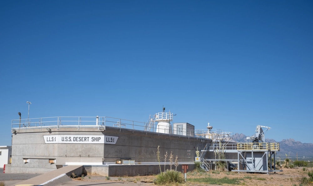 U.S.S. Desert Ship functional duplicates SM fire control requirements of surface ship.