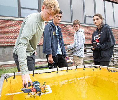 Students in the Undersea Technology Apprentice Program (UTAP) test their unmanned undersea vehicle.