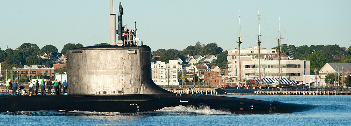 The Virginia-class attack submarine USS Delaware (SSN 791) makes its way up the Thames River and past the city of New London while returning to Submarine Base New London, Oct. 1, 2021