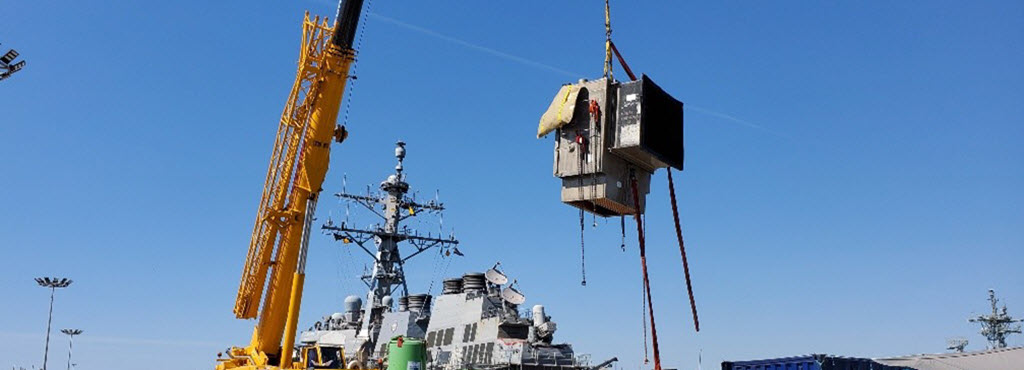 Dry Habitat used to conduct rudder repairs is hoisted from the water