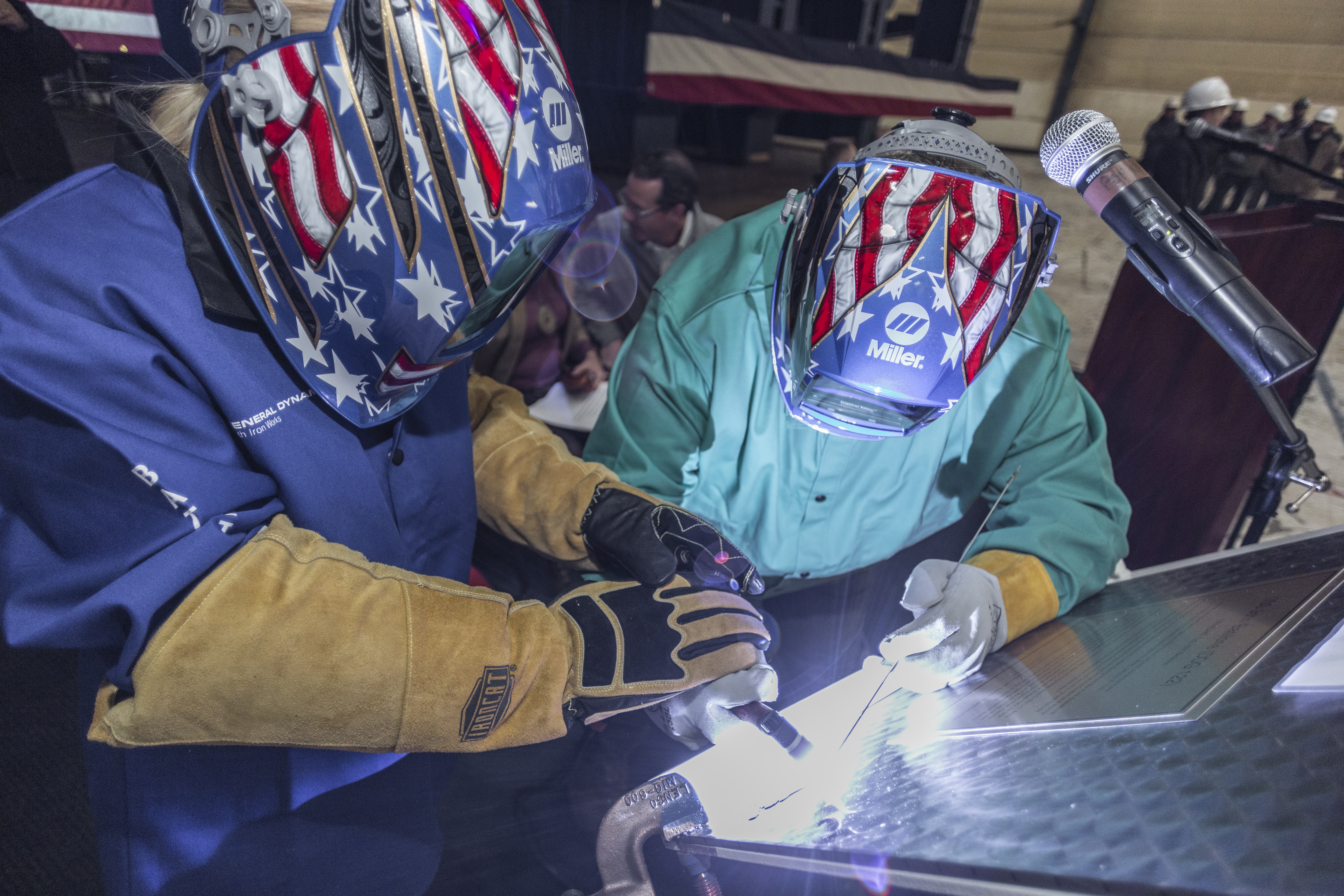 BATH, Maine (Jan. 10, 2020) Ship sponsor Ms. Ryan Manion welds her initials into a steel plate during a keel authentication ceremony for the future USS John Basilone (DDG 122). (Photo courtesy of General Dynamics Bath Iron Works)