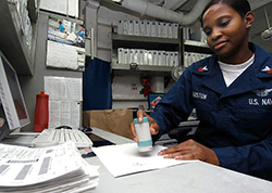 Storekeeper 1st Class Ketina Houston, of St. Marys, Ga., validates supply receipts in S-10 Divisions Quality Assurance office aboard USS George Washington (CVN 73). The Norfolk, Va.-based nuclear powered aircraft carrier is on a regularly scheduled deployment in support of Operation Iraqi Freedom (OIF). (U.S. Navy photo by Photographers Mate Airman Joan Kretschmer/Released)
