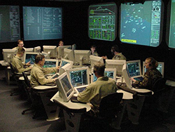Naval reservists, scientists and engineers work in the Integrated Command Environment (ICE) Human Performance laboratory located at NSWC Dahlgren, Va. The ICE lab focuses on the Navy's evolving human performance and human systems integration (HSI) testing. The lab demonstrates the ability to fight future battles with HSI- engineered hardware, software and features common consoles, displays, and knowledge management features that Fleet Sailors helped design to enhance human performance and mission accomplishment. ICE is part of the vision of Sea Power 21. NSWC Dahlgren provides research, development, test and evaluation, engineering, and fleet support for: Surface Warfare, Surface Ship Combat Systems, Ordnance, Strategic Systems, Mines, Amphibious Warfare Systems, Mine Countermeasures, and Special Warfare Systems. U.S. Navy photo (RELEASED)