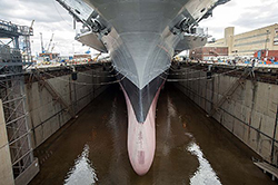 Norfolk Naval Shipyard commences flooding in the dry dock containing the aircraft carrier USS Dwight D. Eisenhower (CVN 69). Dwight D. Eisenhower is undergoing a scheduled docking planned incremental availability at Norfolk Naval Shipyard. (U.S. Navy photo by Mass Communication Specialist Seaman Michael R. Gendron/Released)