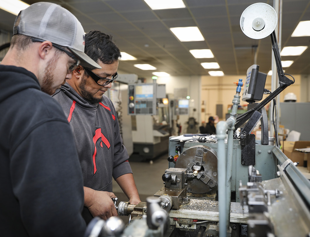 NSWC Corona machinist operate a lathe