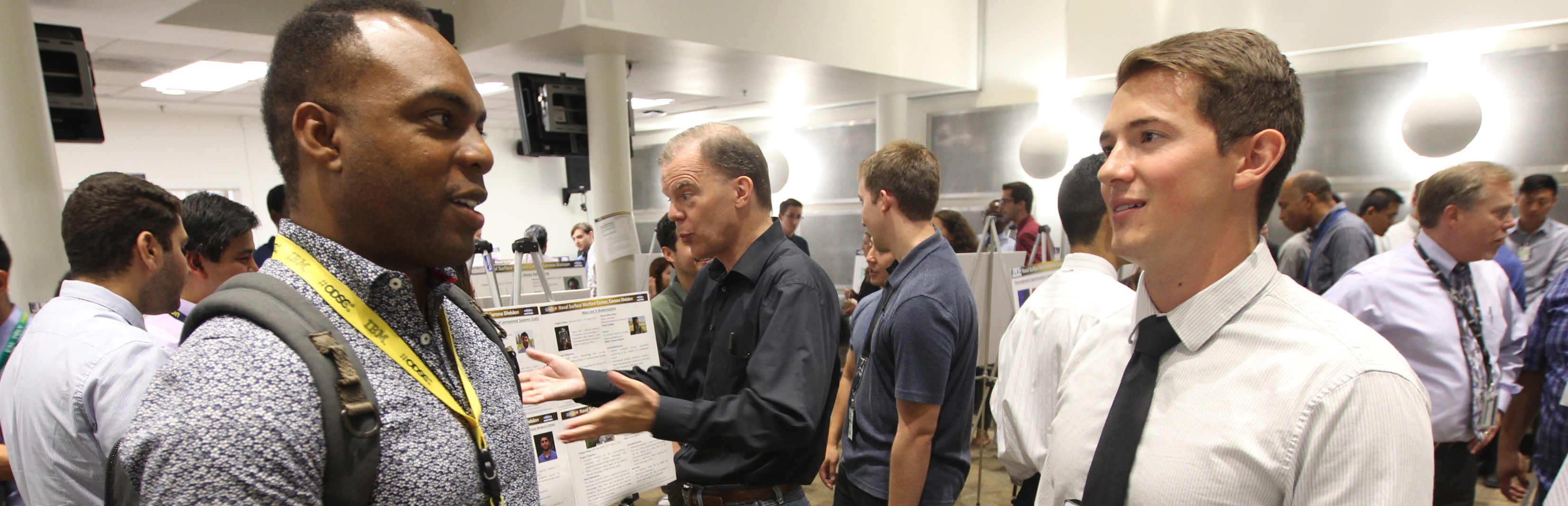NSWC Corona personnel have a discussion during a workshop