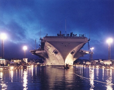Image of an aircraft carrier dockside at Puget Sound Naval Shipyard
